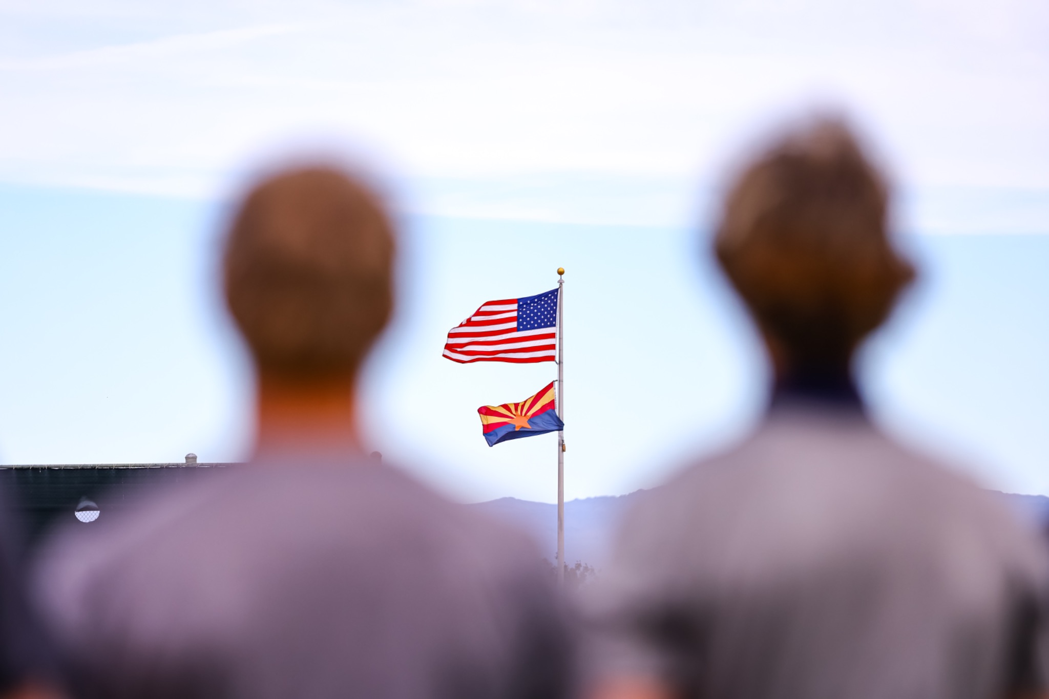 American and Arizona flags flying above Colt Field
