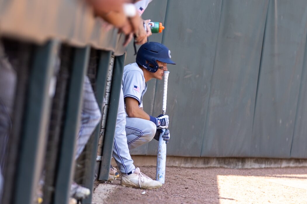 Casteel hitter waits at the dugout steps