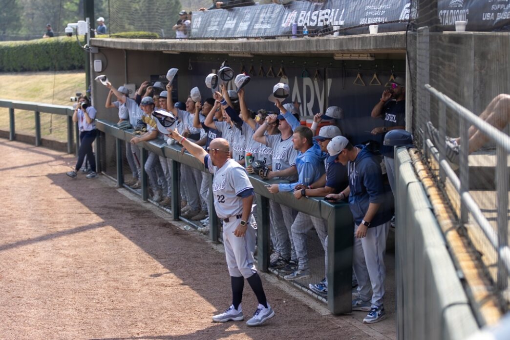 Casteel dugout lifts its hats during the game