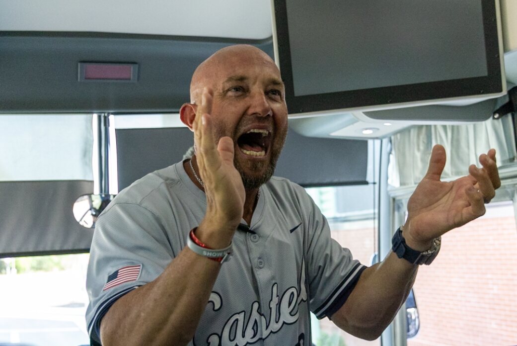Casteel coach celebrates the NHSI win on the team bus